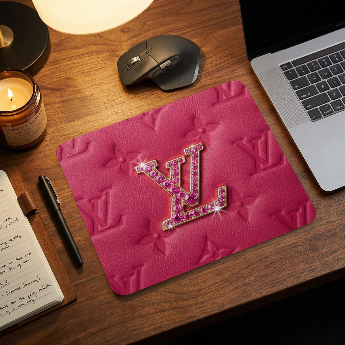 Pink mousepad with embossed LV monogram and crystal embellished logo.