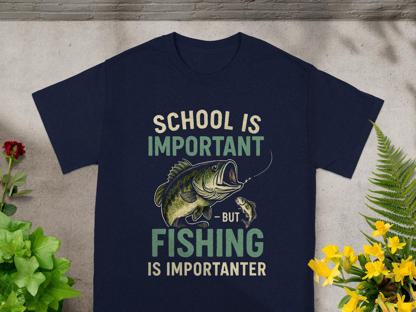 Navy t-shirt with "SCHOOL IS IMPORTANT - BUT FISHING IS IMPORTANTER" text and fishing graphic.
