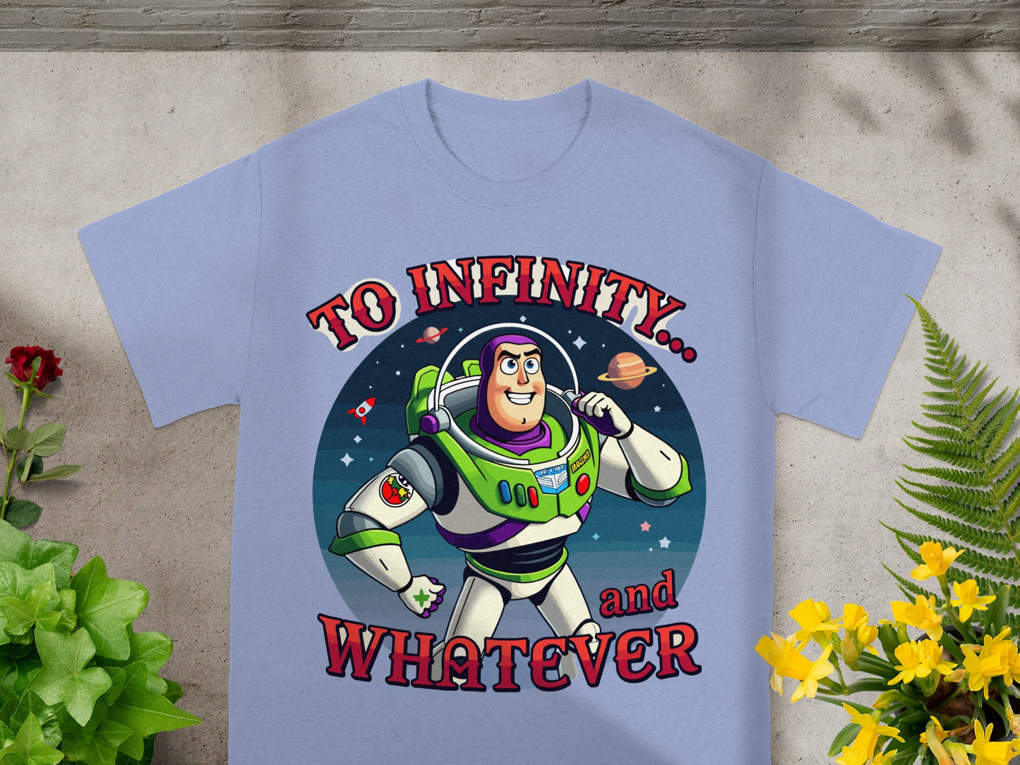 Buzz Lightyear on a light blue t-shirt with "To Infinity... and WHATEVER" text.