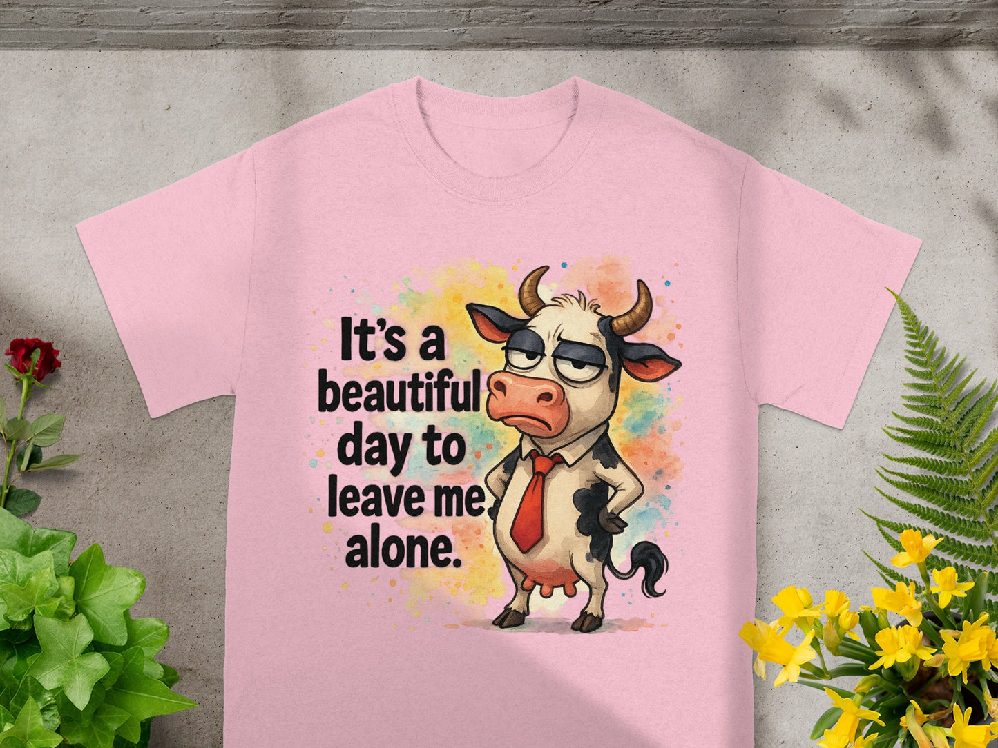 Pink t-shirt with cartoon cow saying "It's a beautiful day to leave me alone."