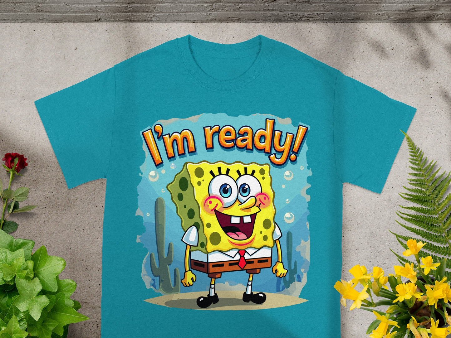 SpongeBob SquarePants in underwater scene on blue t-shirt saying "I'm ready!"