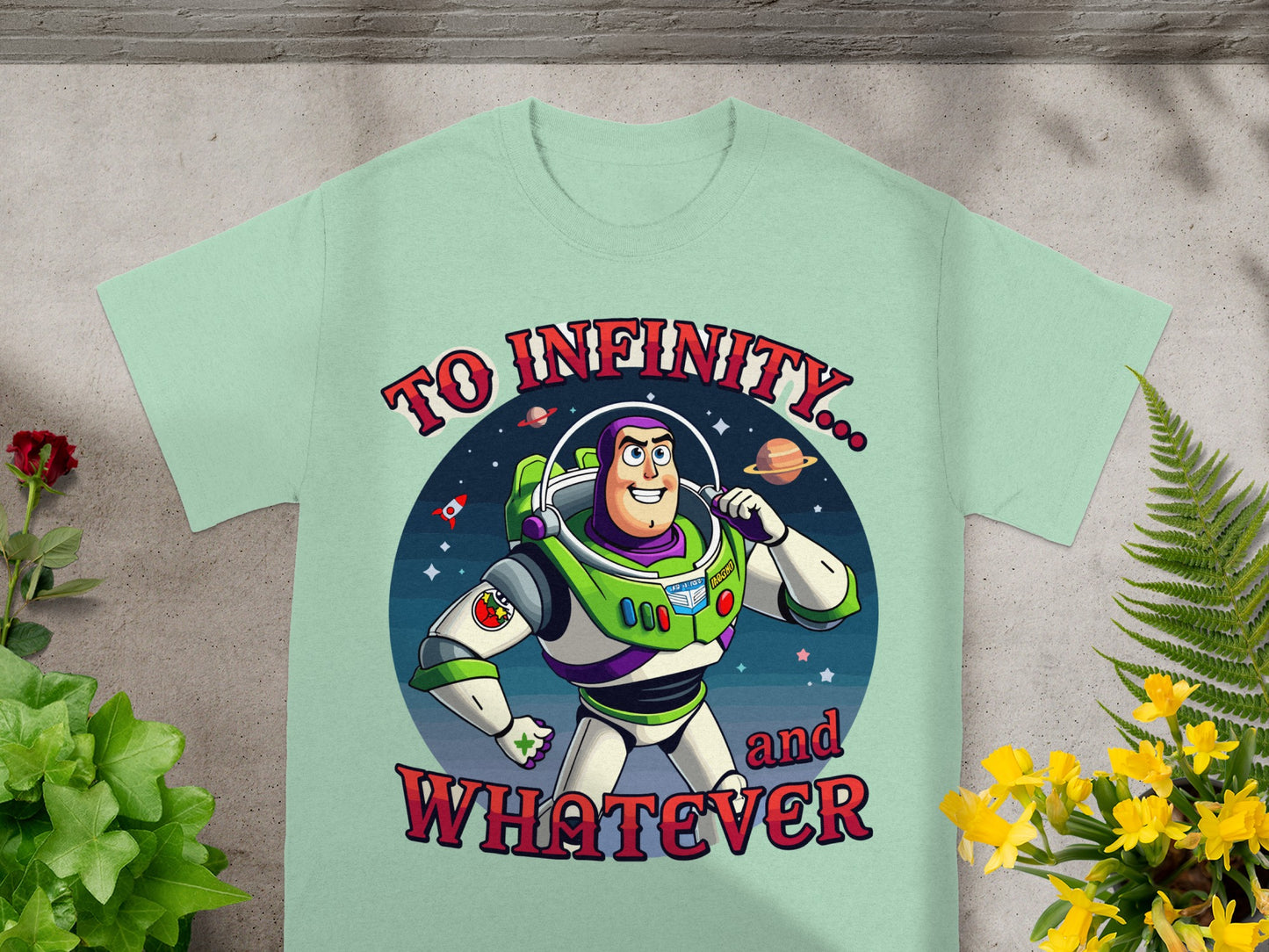 Buzz Lightyear on a mint green t-shirt with "To Infinity... and WHATEVER" text.
