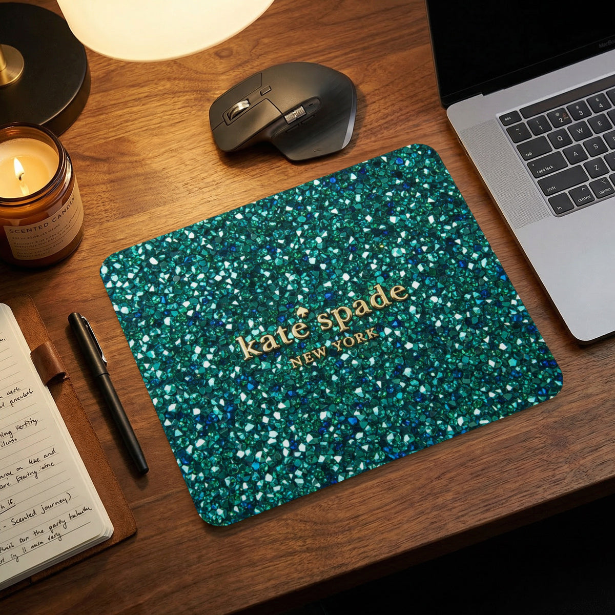 Kate Spade New York mousepad with a green glitter design.