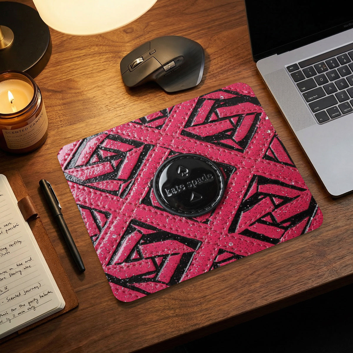 Kate Spade mousepad with geometric pattern and logo on a wooden desk.