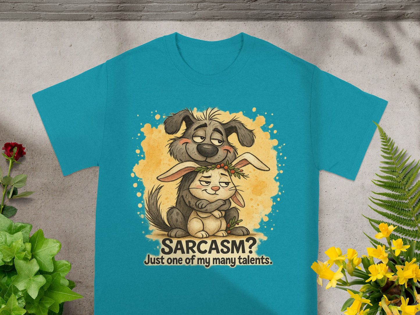 Teal t-shirt with cartoon dog hugging a rabbit and text "SARCASM? Just one of my many talents."