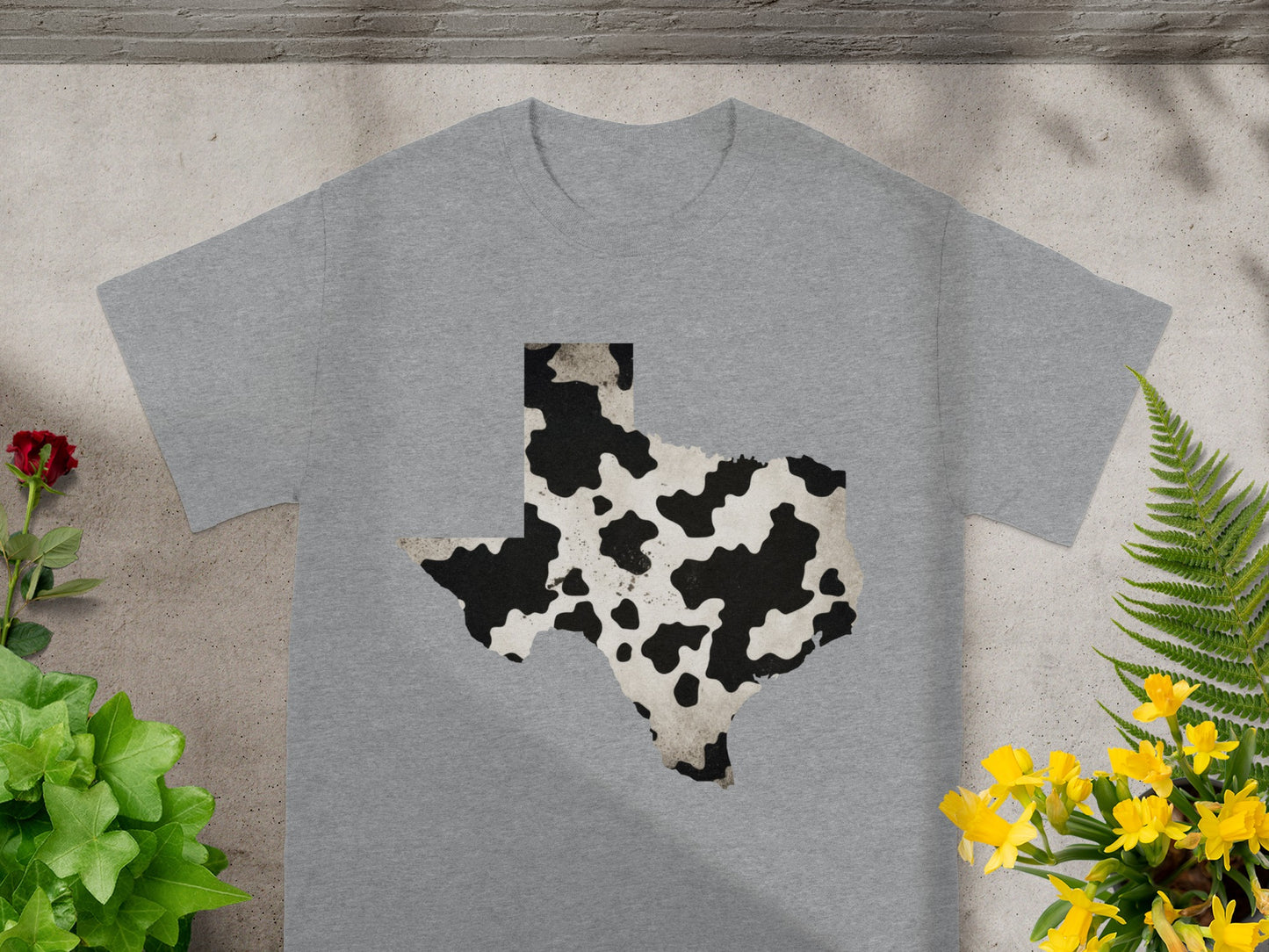 Grey t-shirt with a Texas shape graphic in cow print pattern.