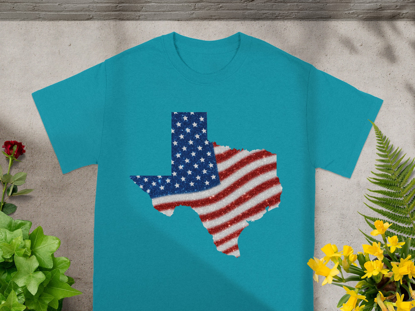 Teal t-shirt with glittery Texas outline filled with American flag pattern.