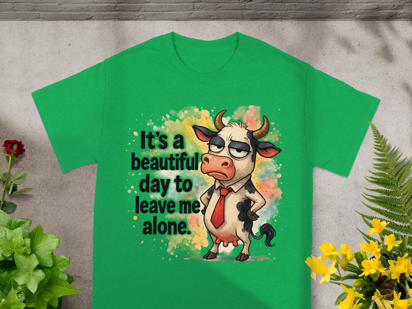 Green t-shirt with a cartoon cow saying "It's a beautiful day to leave me alone."