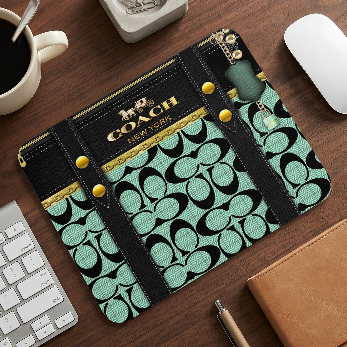 Coach New York logo mousepad with black and mint green monogram pattern.
