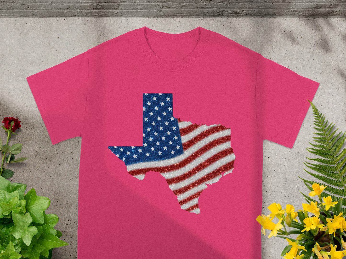 Pink t-shirt with glittery Texas shape filled with American flag design.