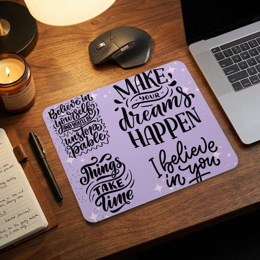 Mousepad with motivational quotes "Make your dreams happen" and "Believe in yourself".