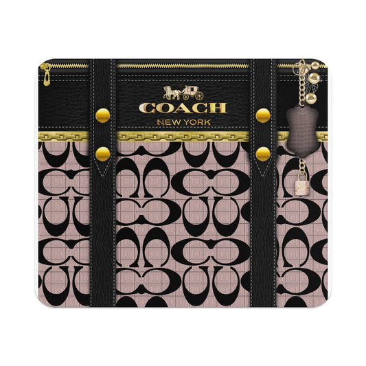 Coach New York logo with horse and carriage on black leather, pink signature pattern, and gold hardware.