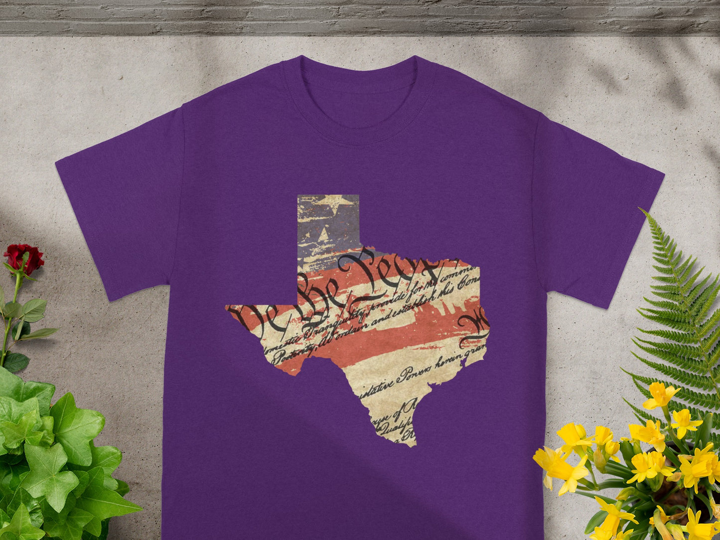 Purple t-shirt with Texas outline filled with US Constitution text and flag.