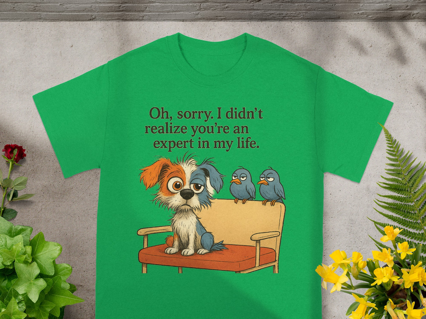 Green t-shirt with graphic of dog and birds, text "Oh, sorry. I didn't realize you're an expert in my life."
