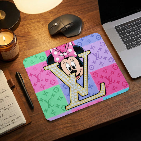 Minnie Mouse with a diamond-encrusted "LV" logo on a pastel patchwork mousepad.