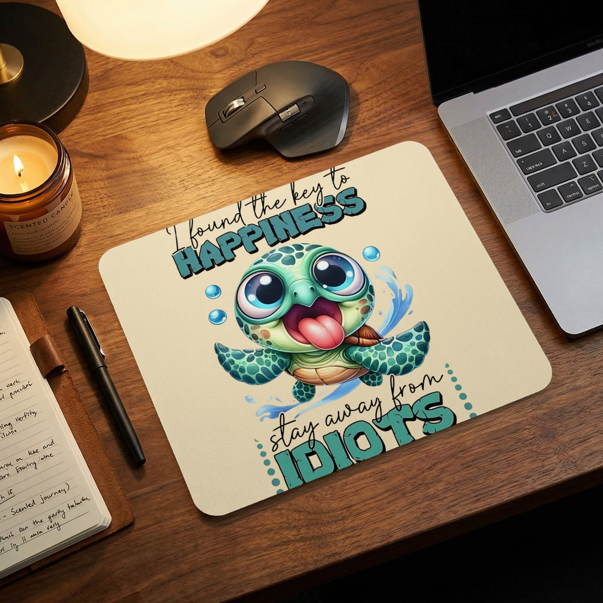 Beige mousepad featuring a cartoon turtle and the text, I found the key to happiness stay away from idiots.