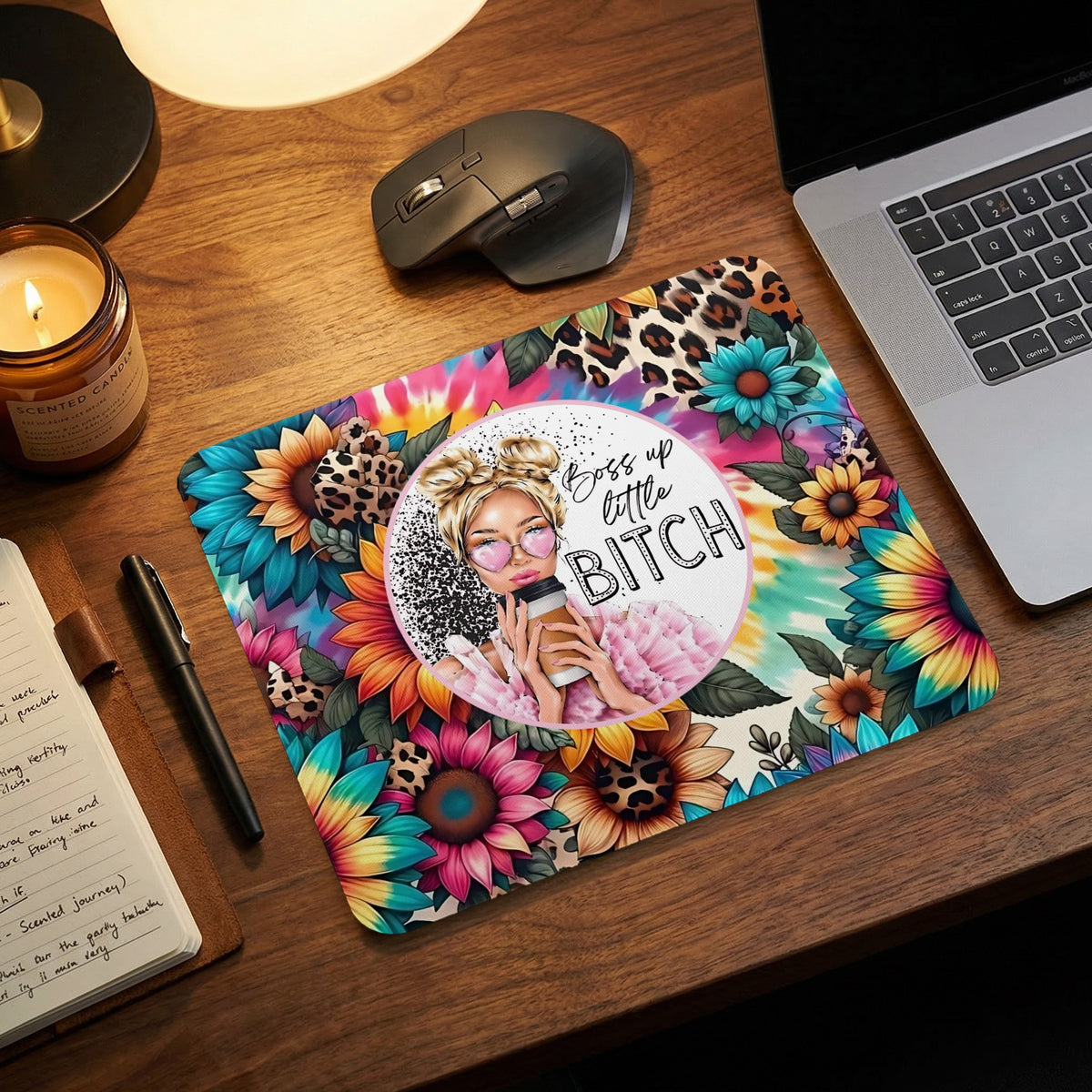A colorful floral mousepad with a graphic woman drinking coffee and text reading boss up little bitch.