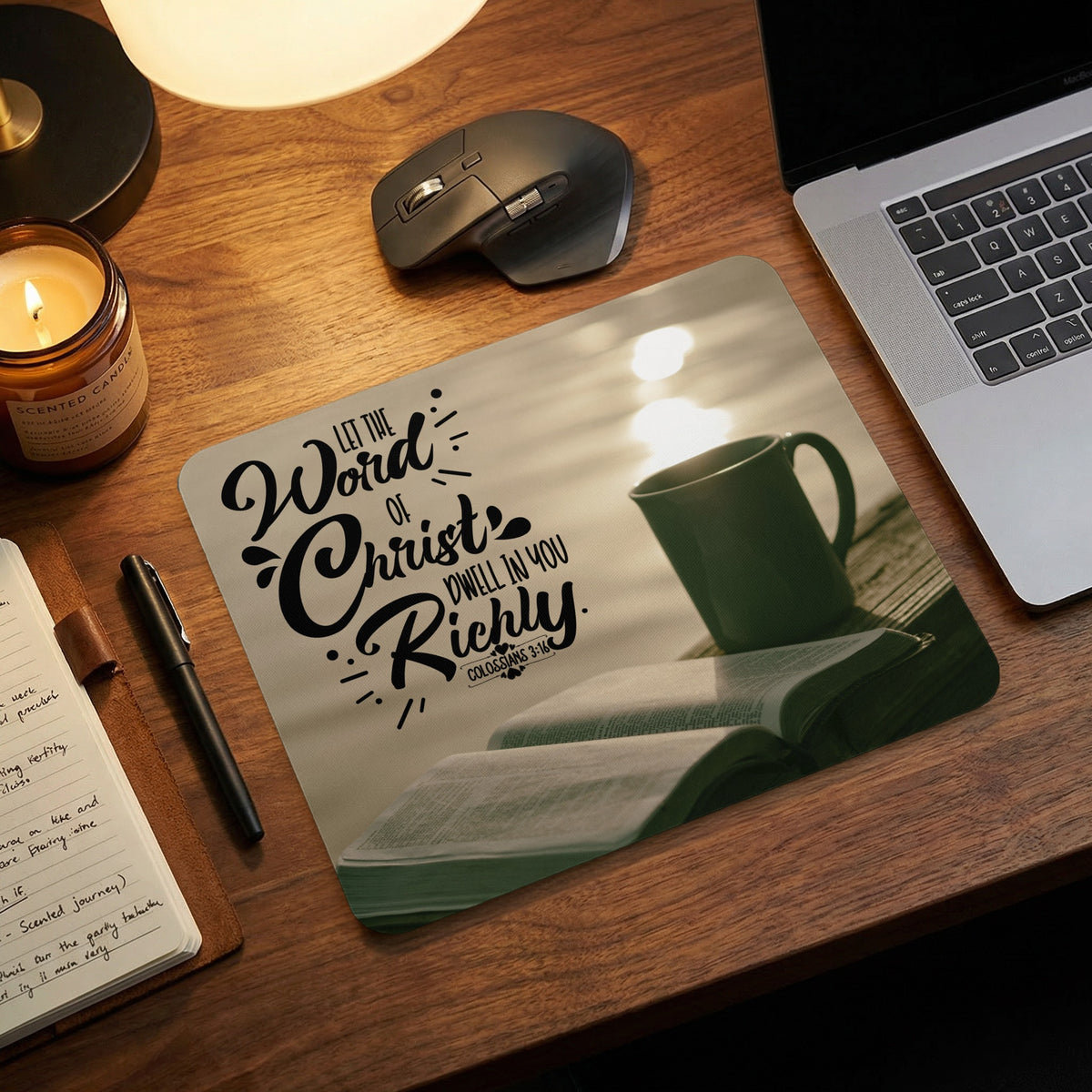 A mousepad featuring a Bible, mug, and the verse Let the Word of Christ Dwell in You Richly.