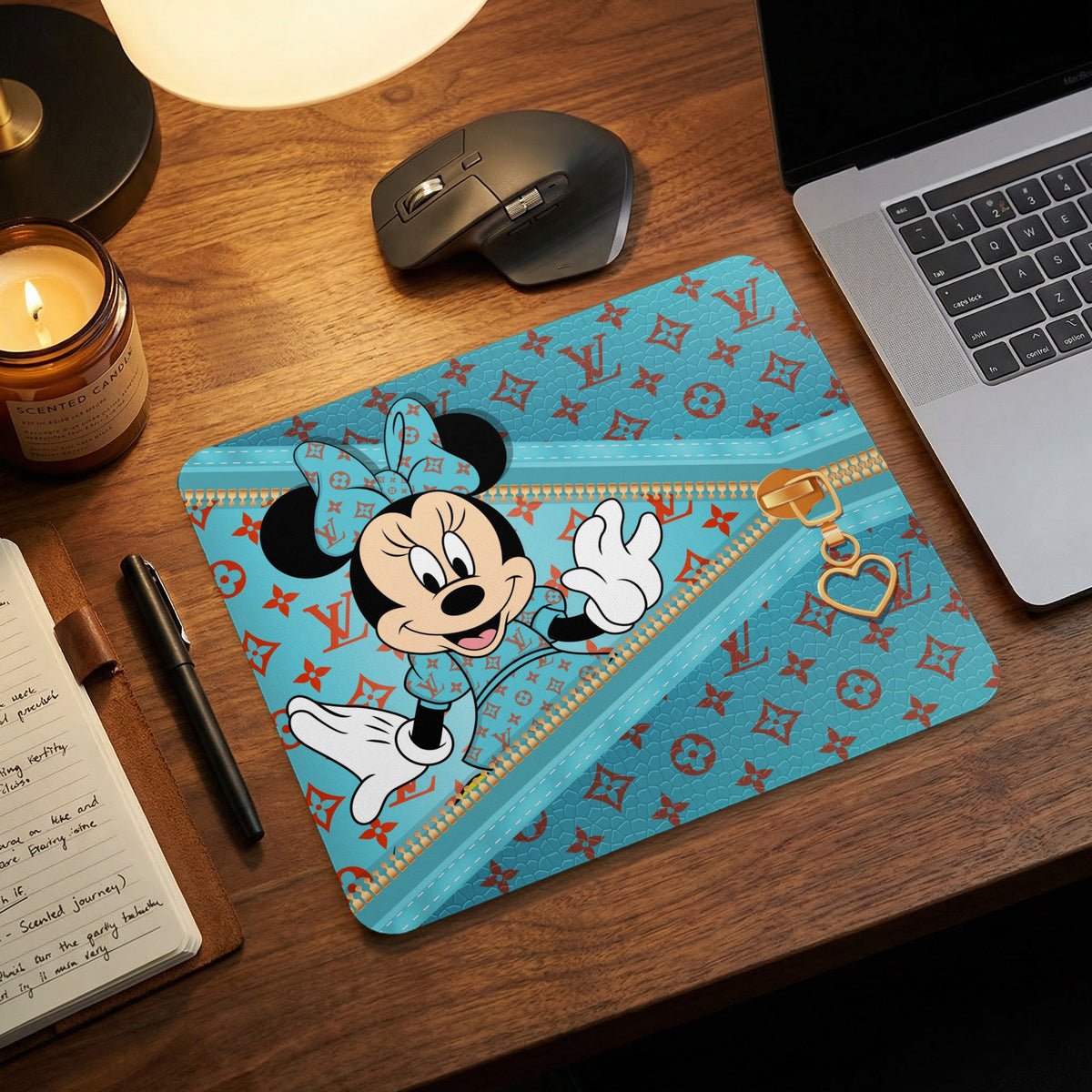 Minnie Mouse mousepad with a teal background and repeating orange pattern, featuring a zipper design.