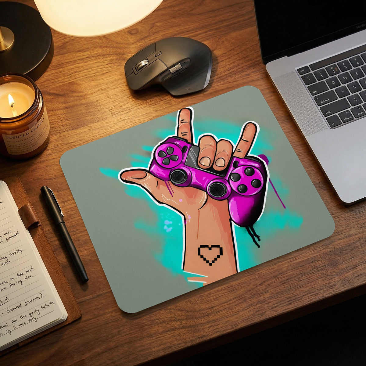 Rectangular mousepad featuring a hand making a rock-on sign while holding a pink video game controller.