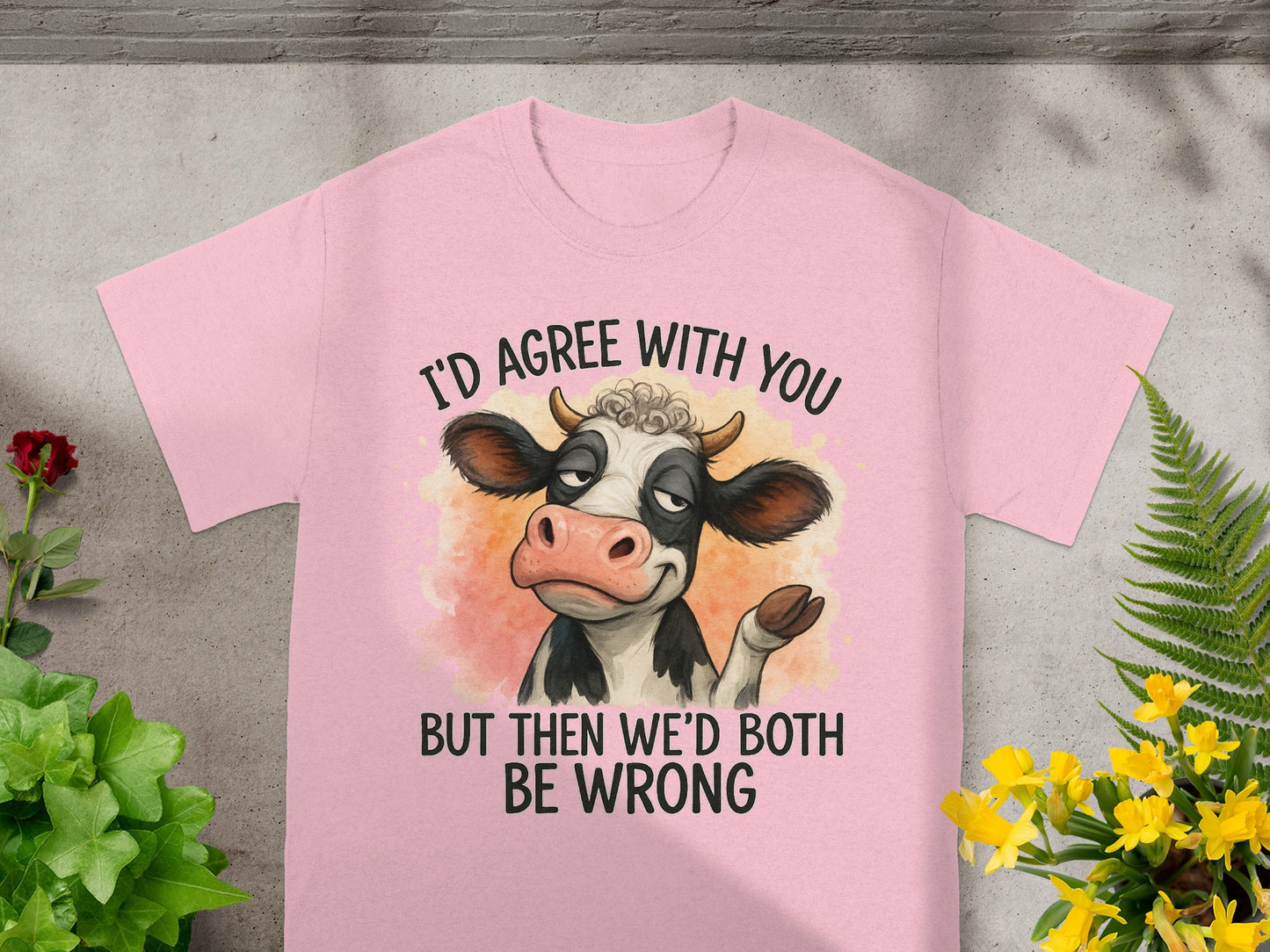 Pink t-shirt with a cartoon cow and text "I'd agree with you but then we'd both be wrong".