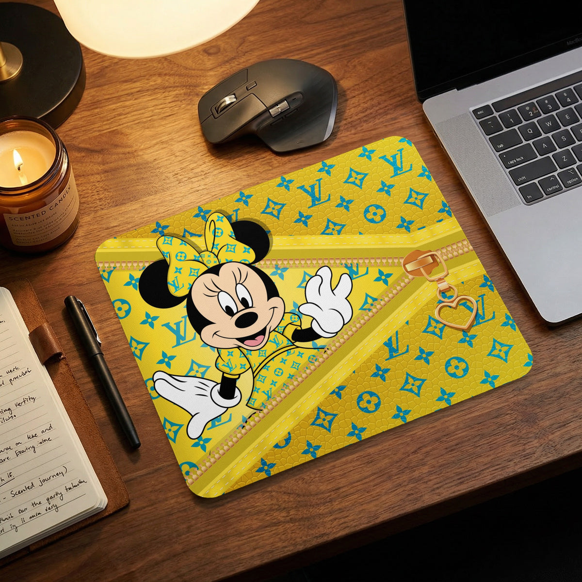 Minnie Mouse on yellow mousepad with blue Louis Vuitton-inspired pattern and gold zipper detail.