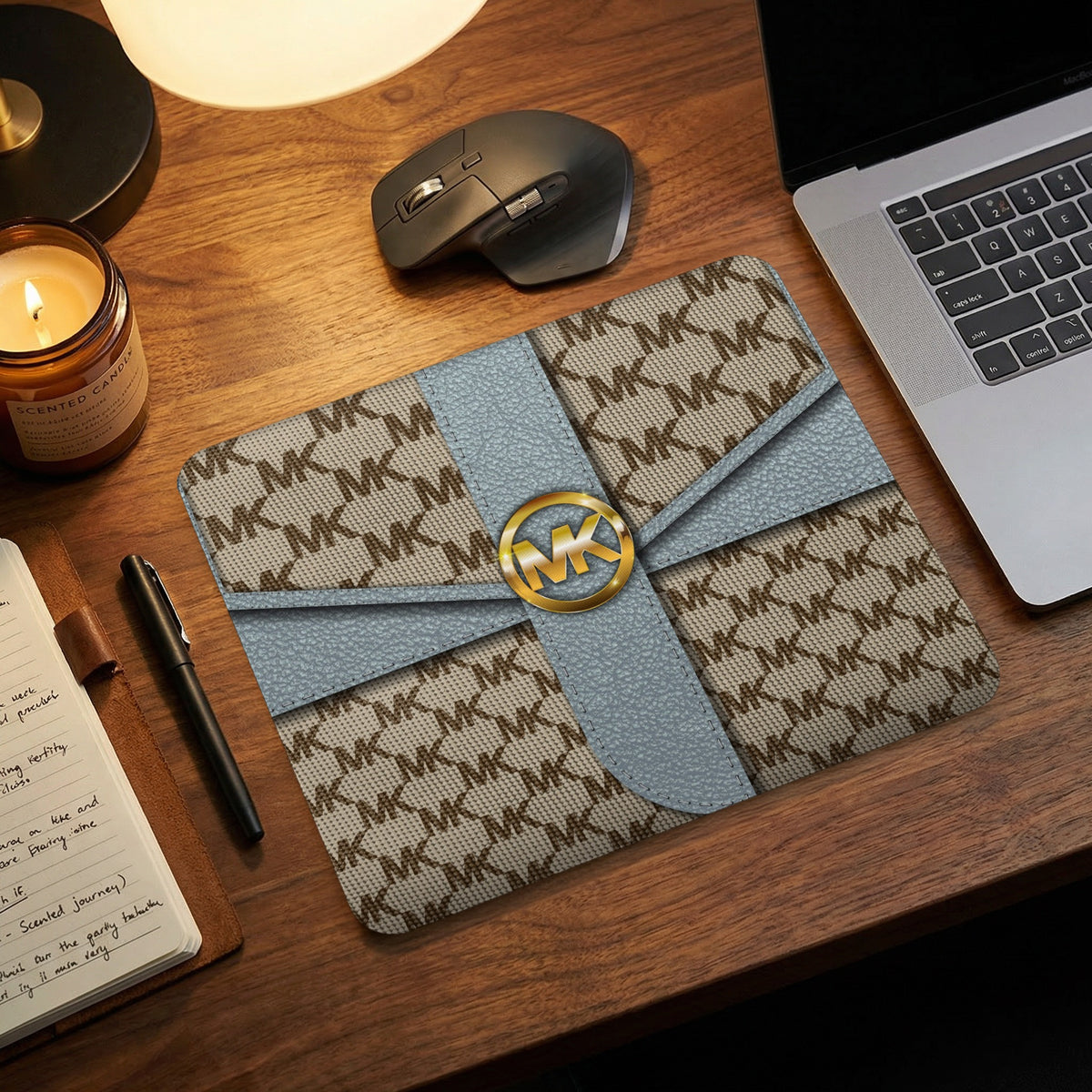 Michael Kors patterned mouse pad with a gold MK logo.