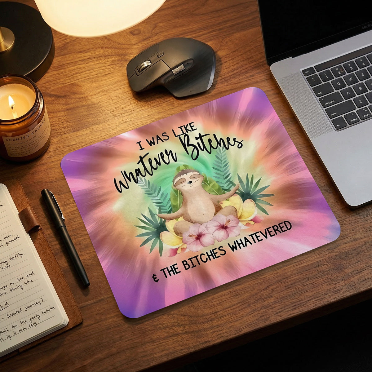 A tie-dye mousepad featuring a meditating sloth and the text I WAS LIKE WHATEVER BITCHES & THE BITCHES WHATEVERED.