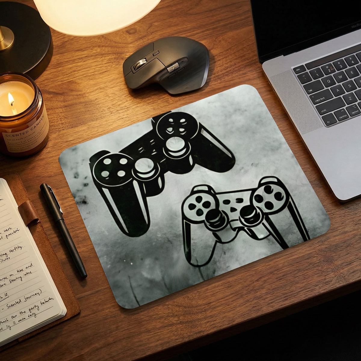 Gaming mouse pad featuring a graphic of two game controllers on a wooden desk.