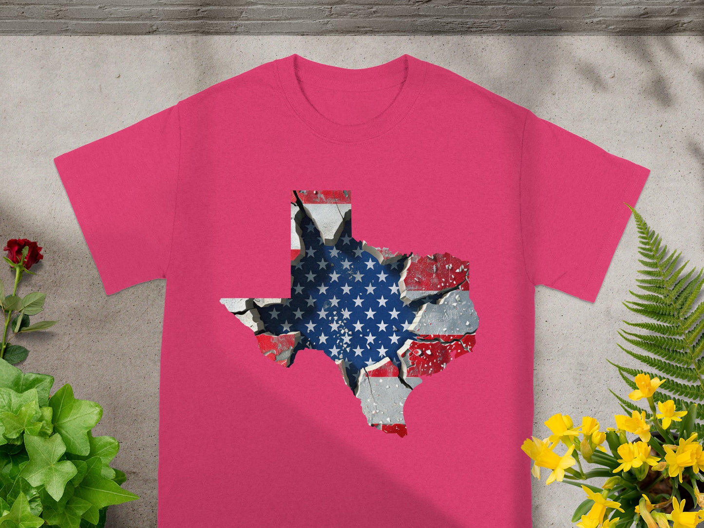 Pink t-shirt with Texas map overlay of cracked American flag.