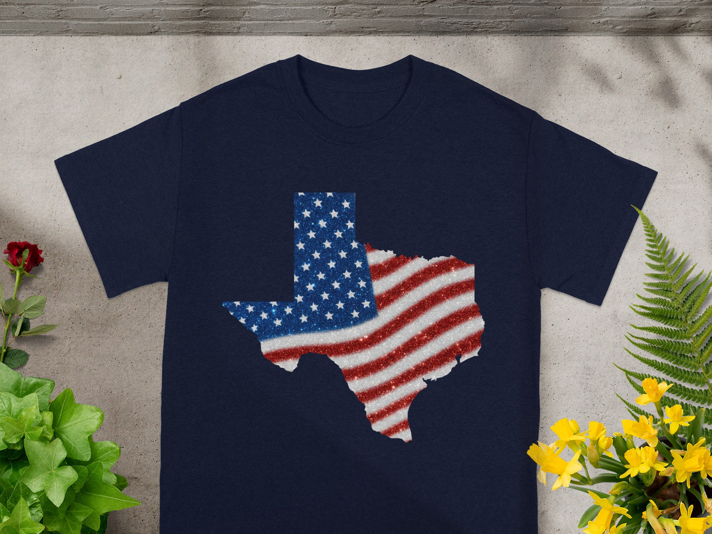 Navy t-shirt with Texas silhouette filled with glittering American flag design.